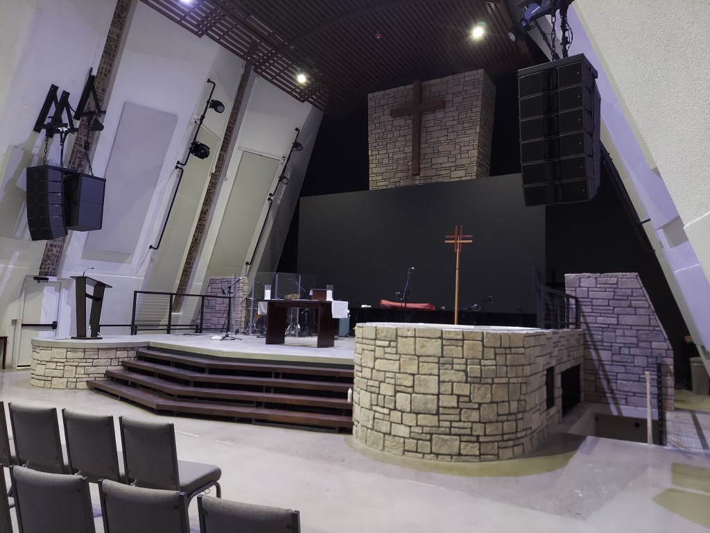 Clean church stage and platform area with polished floors