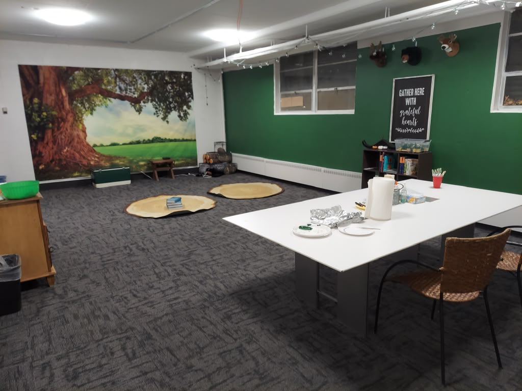 Freshly cleaned classroom with vacuumed carpet and wiped tables